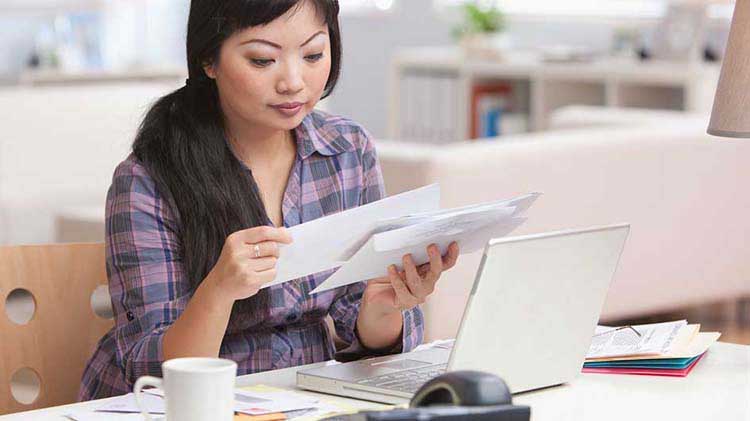 Woman going through papers.