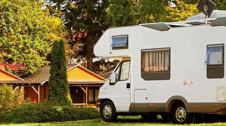 RV parked near vacation cottages