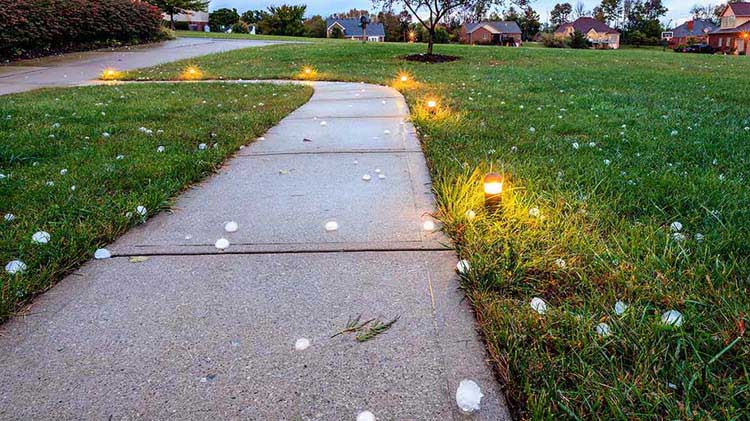 Hail covering a road.