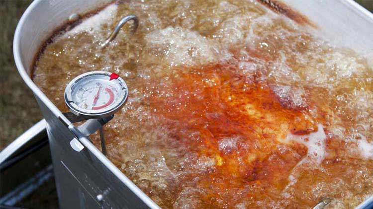 Safely frying a turkey in a deep fryer.