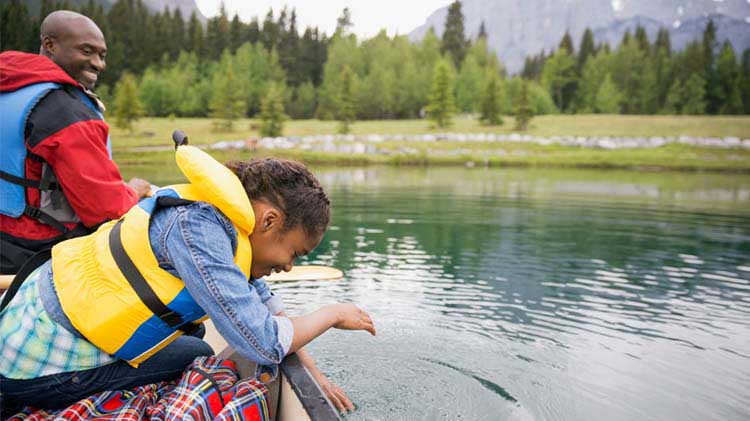 Father and daughter on a boat.