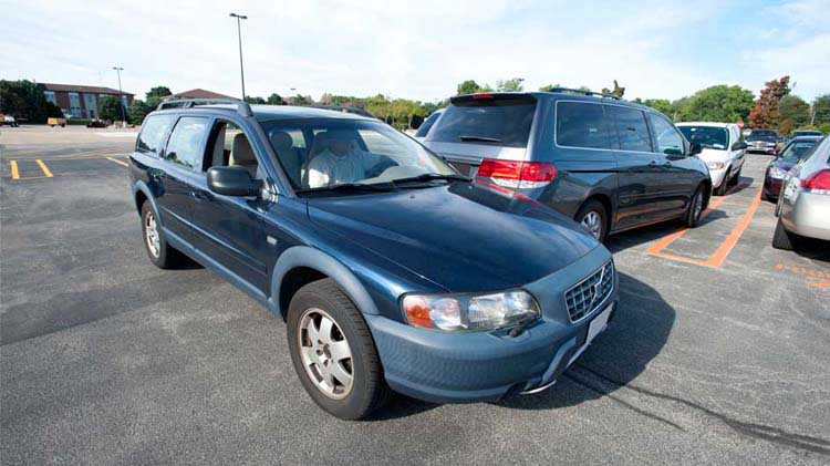 A car driving in a parking lot