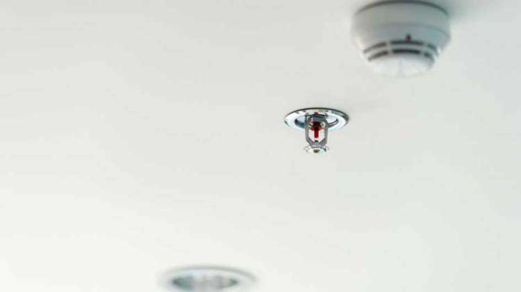 Fire sprinkler system on a ceiling.