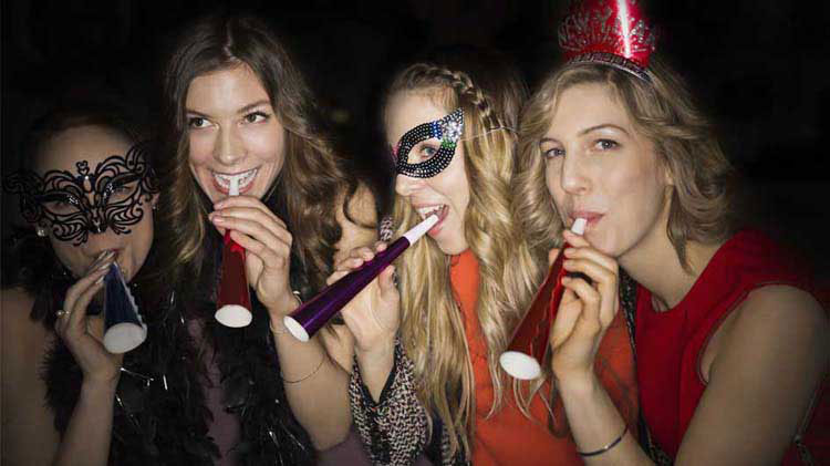 Ladies celebrating at a New Year's Eve party.