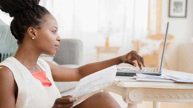 Woman on her laptop researching Health Savings Accounts.