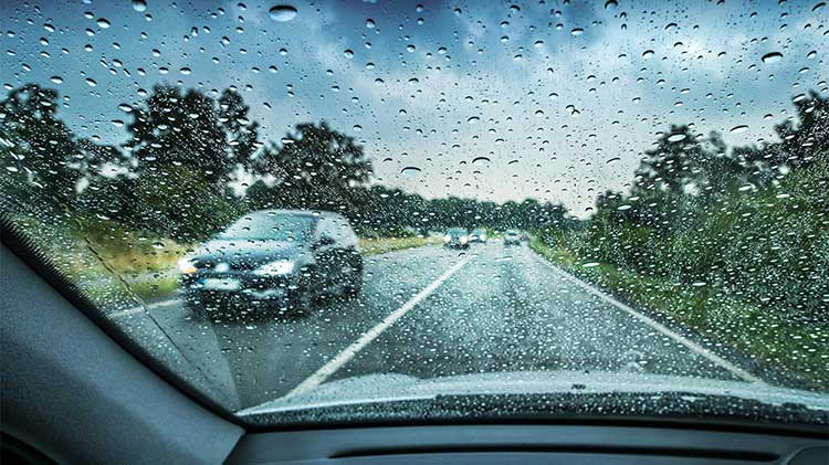 Car driving in the rain