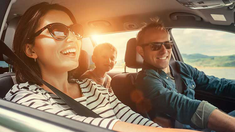 Happy family driving to Mexico while on vacation.