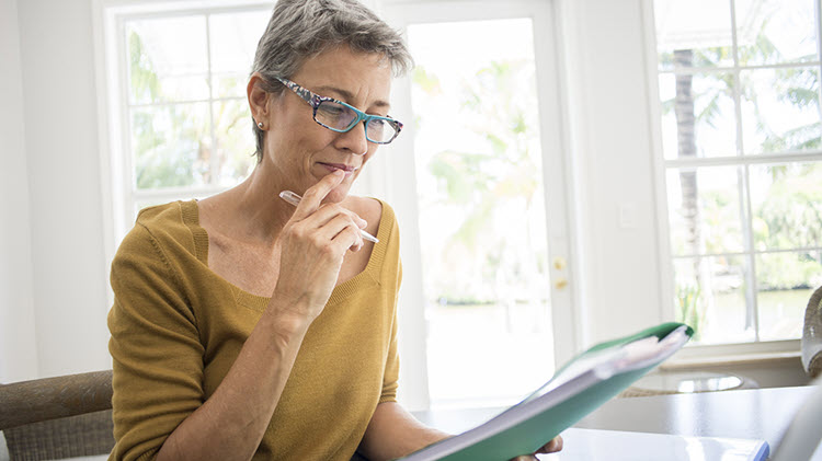 Woman reviewing her life insurance policy.