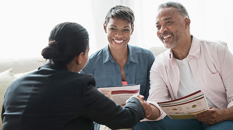 A couple is receiving retirement advice.