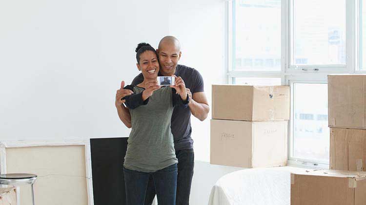 A couple celebrating their new apartment.