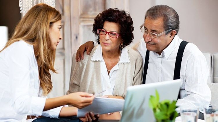 Couple seeking advice on health care and tax deductions.