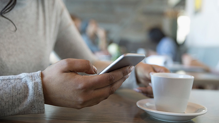 Woman using phone to visit online sites