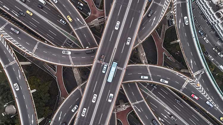 Aerial view of highway and overpass.