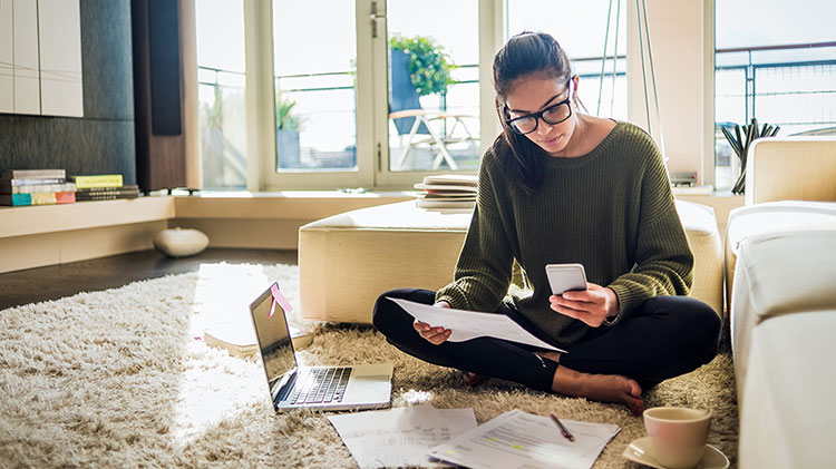 A woman is making financial decisions about college.