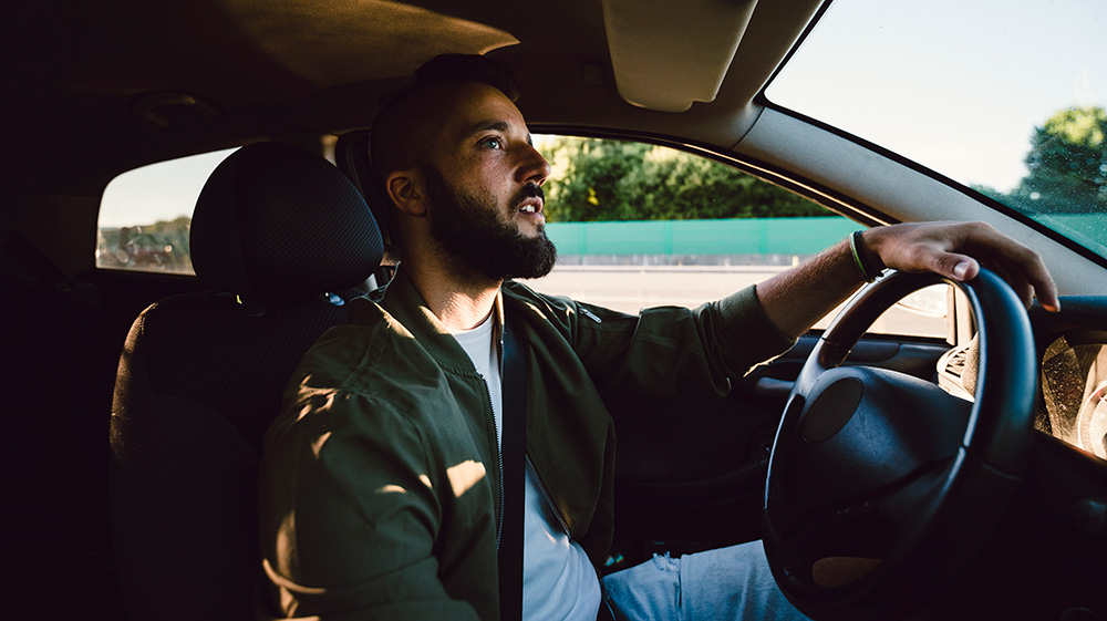 Man driving a car