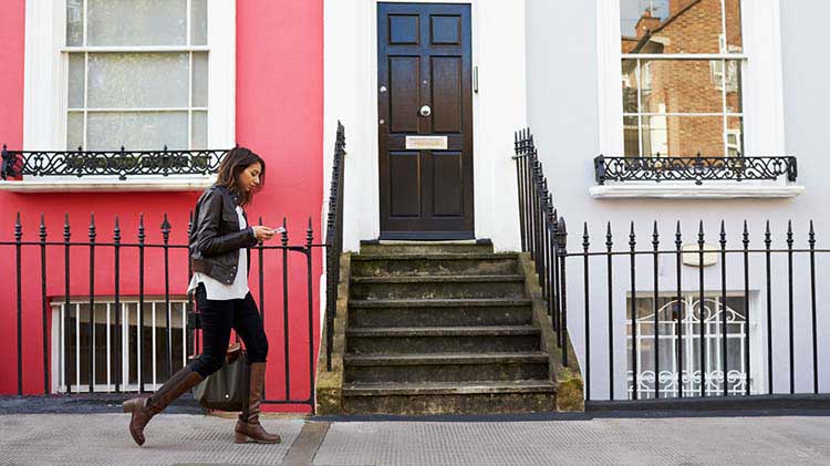 Lady using a renters guide to help select her new apartment.